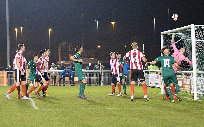 Lincoln keeper Paul Farman tips a Nantwich shot over the bar