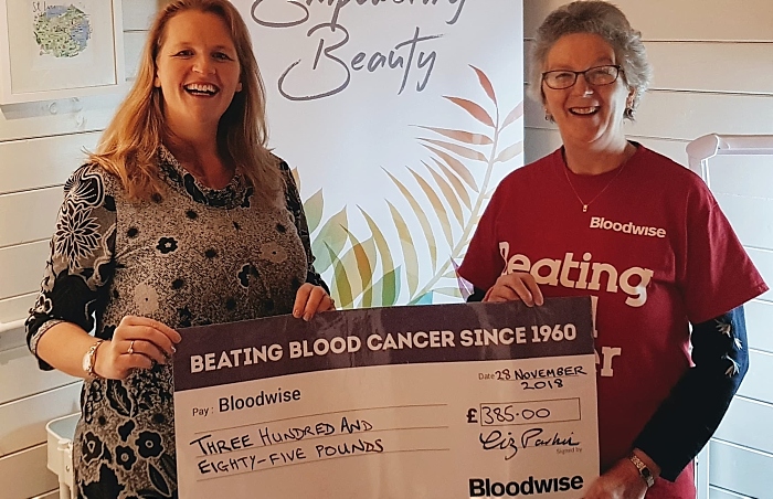 Liz Parkin - left - from Bluebell Beauty presents the cheque to Liz Boffey from Bloodwise South Cheshire