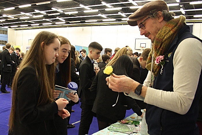 CaMadison Matravers and Leah Hadzik watch as David Billington from Reaseheath Horticultural department shows them the art of making a floral buttonhole