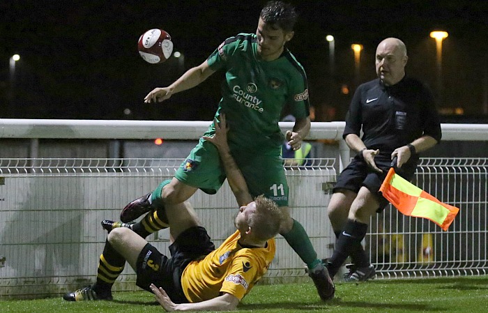 Marine defender James Short takes the ball from Jordan Davies