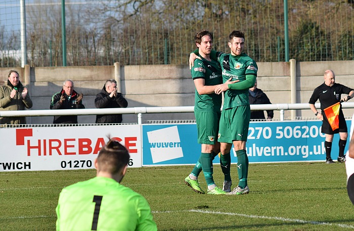 Matt Bell celebrates his goal with Ryan Brooke in front of distraught Corby Town players