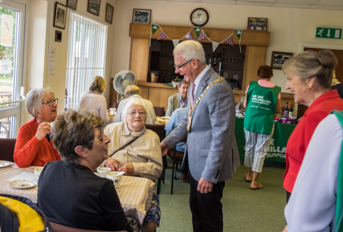 Mayor Cllr Moran chats to Macmillan Coffee morning visitors