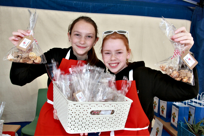 Megan Brown, 12, and Lauren Jervis, 11, selling their homemade dog treats