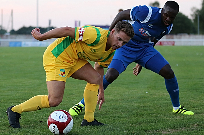 Nantwich Town eye the ball v Salford City