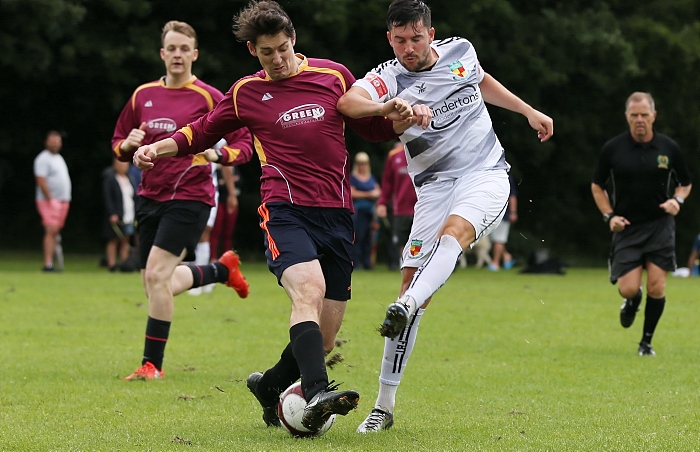 Nantwich Town player Callum Saunders shot is blocked by Wybunbury (1)