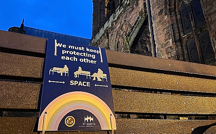 Nantwich bench with social distancing sign - outside St Marys Church (1) (1)