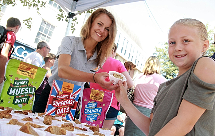 Nantwich girl Alicia Lewis, nine, samples a flapjack from Schoolsfest sponsors Mornflake