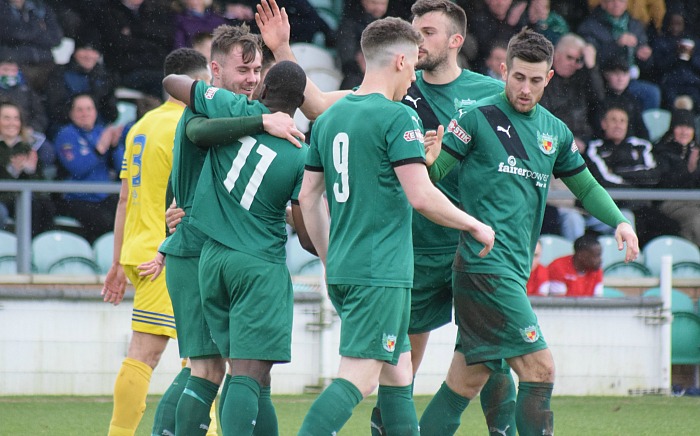 Nantwich goalscorer John Johnston celebrates with teammates against Grantham