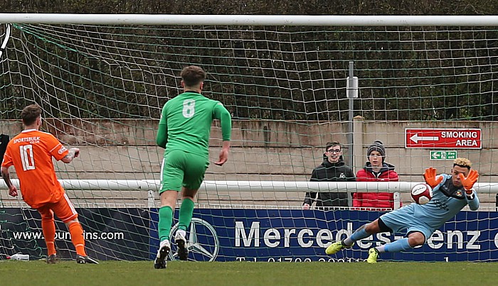 Nantwich keeper Myles Boney saves a penalty