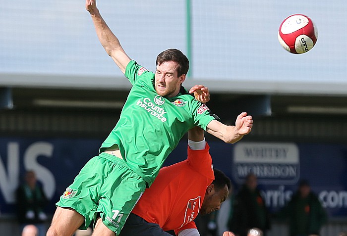 Nathan Cotterell challenges for the ball