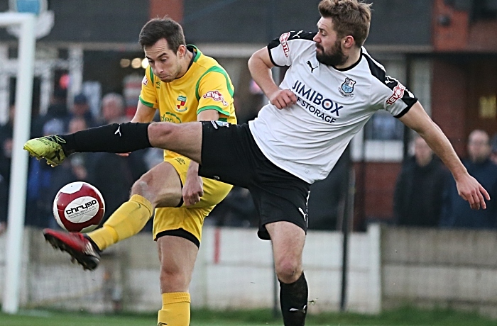 Nathan Cotterell_ kicks the ball forward under pressure (1)