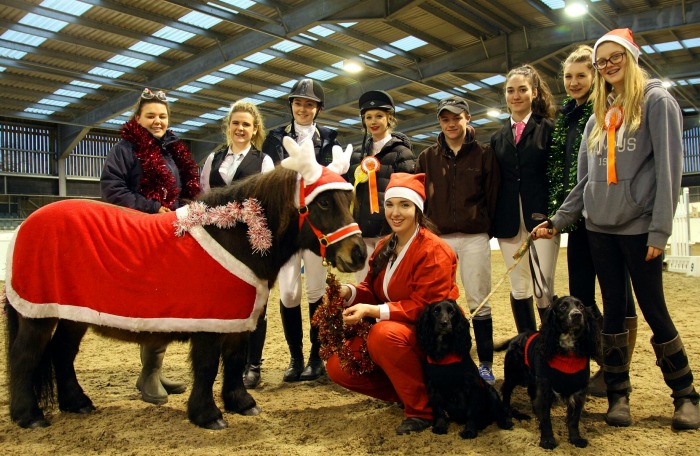 Nina Anderson-smith with pony Ember, dogs Bella and Sparky and horse management students fancy dress