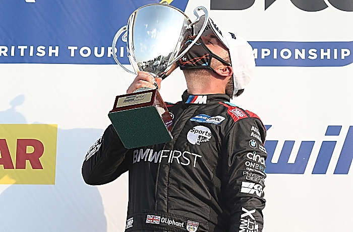 Oliphant with trophy after maiden BTCC victory at Brands Hatch