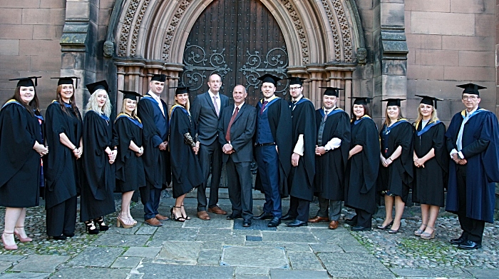 graduates outside the church