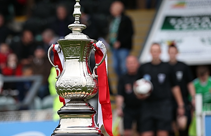 Pre-match - The FA Cup Trophy on display at the Weaver Stadium as officials, mascots and players emerge from the tunnel (1)