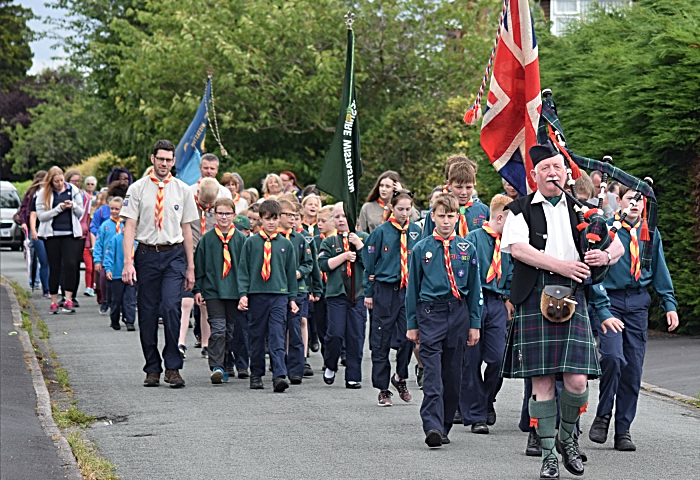 Fete - Procession led by Scottish Piper Reg Flower