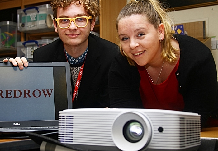 Redrow's Laura Hayward pictured trying out the new projector at Nantwich Museum with Elliot Goodger (1)