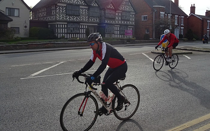 Riders pass Churches Mansion in Nantwich