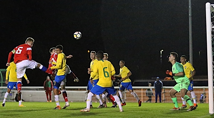 Russia captain Litvinov Ruslan heads the ball towards the Brazil goal