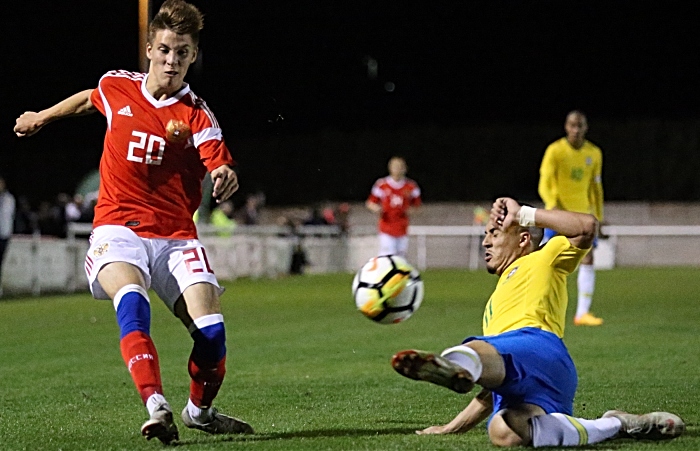 Russia player Faizullin Denis crosses the ball