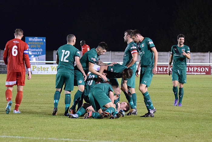 ryan-brooke-on-the-ground-celebrates-his-wonder-goal-with-teammates