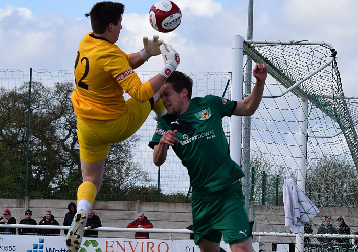 Ryan Brooke takes a knock to the face from Ilkeston goalkeeper Jamie Hannis