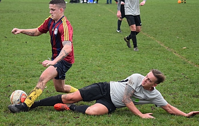 Salvador player tackles for the ball from Talbot (1)