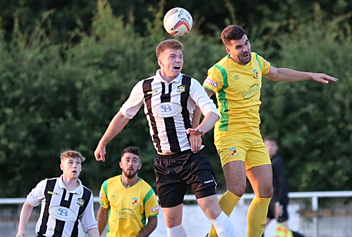 Sam Wakefield challenges for the ball against Alsager