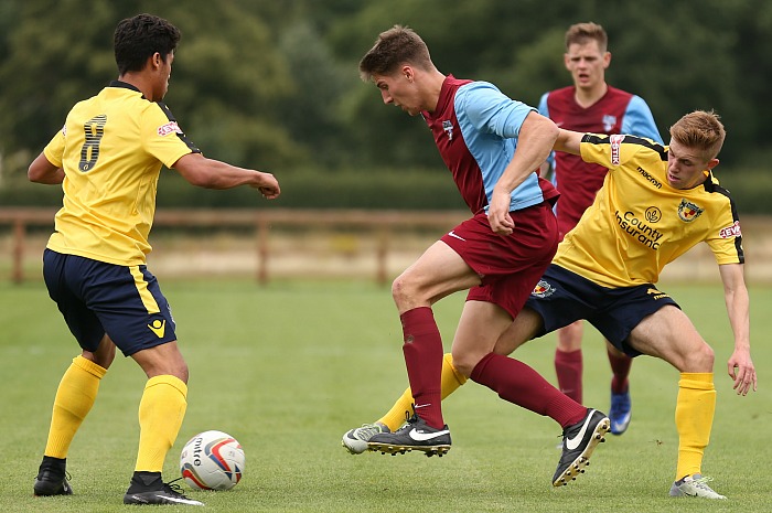 Sandbach United fight for the ball