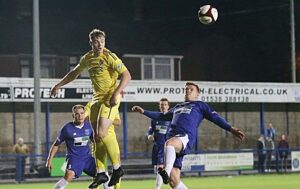 Second-half - Connor Heath rises to win the ball