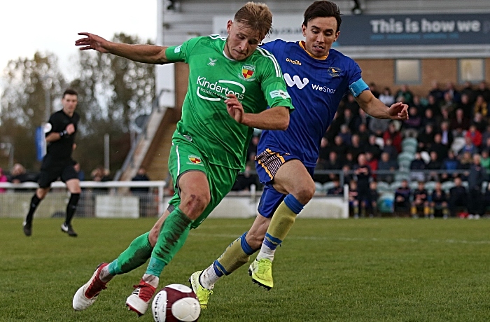 Second-half - David Webb goes forward under pressure from King's Lynn captain Michael Clulan (1)