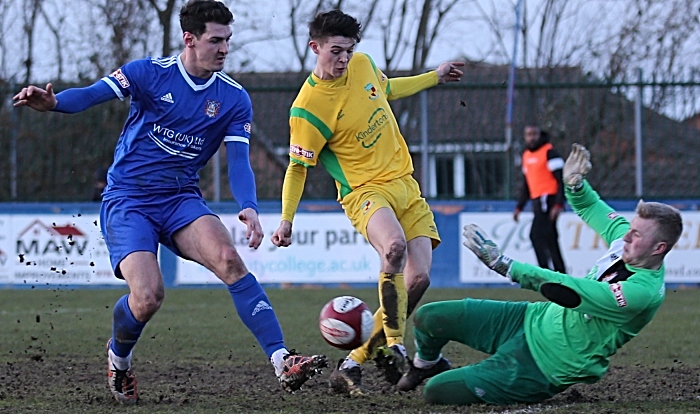 Second-half - Farsley Celtic keeper Kyle Trennery blocks the ball under pressure from Joe Malkin