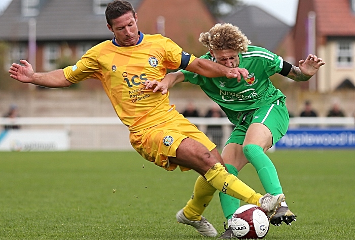 Second-half - Lancaster midfielder David Norris received a yellow card for this strong challenge on Luke Walsh (1)