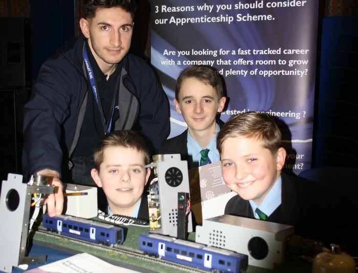 Shaun Jones from Unipart Rail explains 'safety systems' to Samuel Suggate, James Carless and Miles Fullerd.