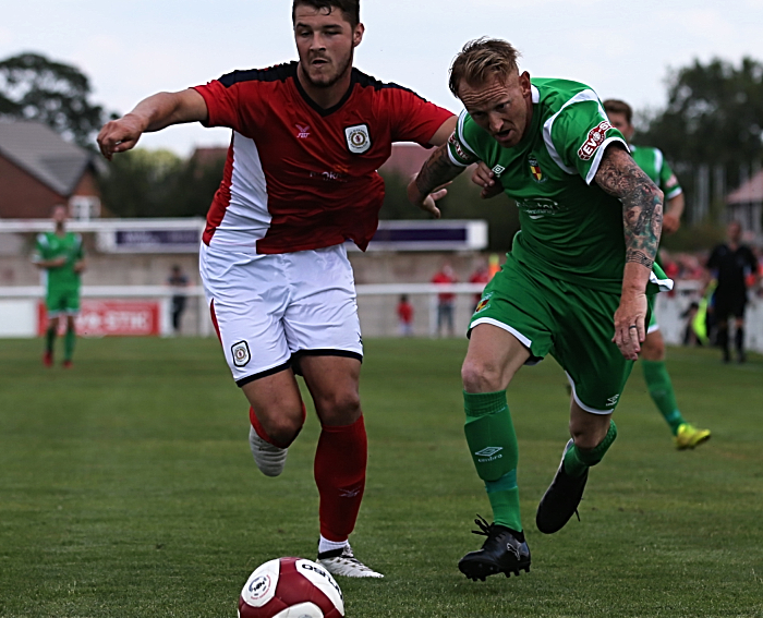 Steve Jones challenges for the ball (1)