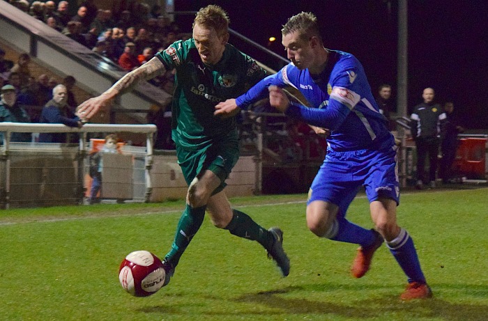 Steve Jones fights for the ball - Nantwich reach Cheshire Senior cup final