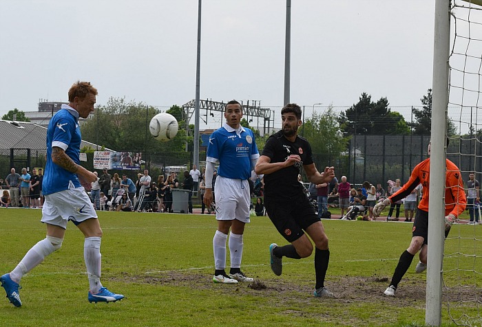 Steve Jones scores with a header for Team Carl