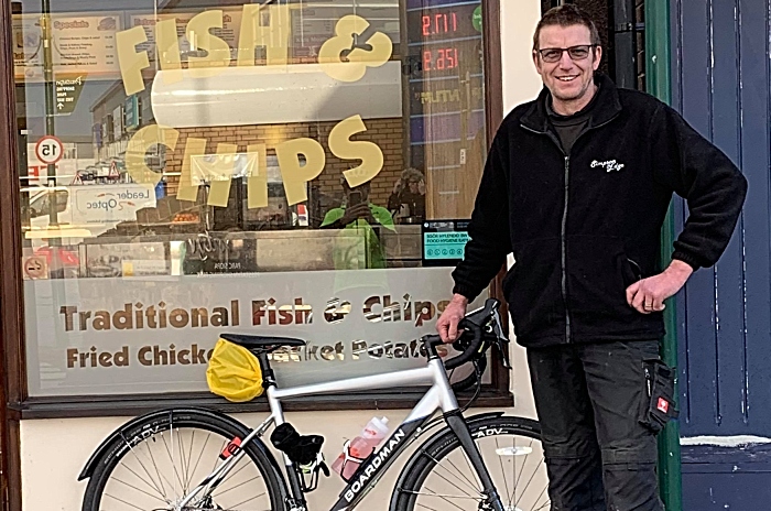 Support crew Rob Simpson with Roy Prices bike outside Crispy Cod in Prestatyn (1)