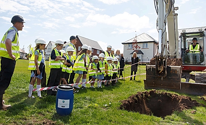 The team from Bloor Homes Wistaston Brook with staff and children from Wistaston Church Lane Academy as they prepare to bury the time capsule (1)