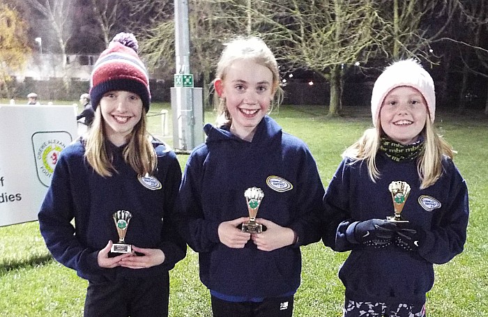 U11 girls team second Lucy Salter Sophie Harding and Ruby Johnson