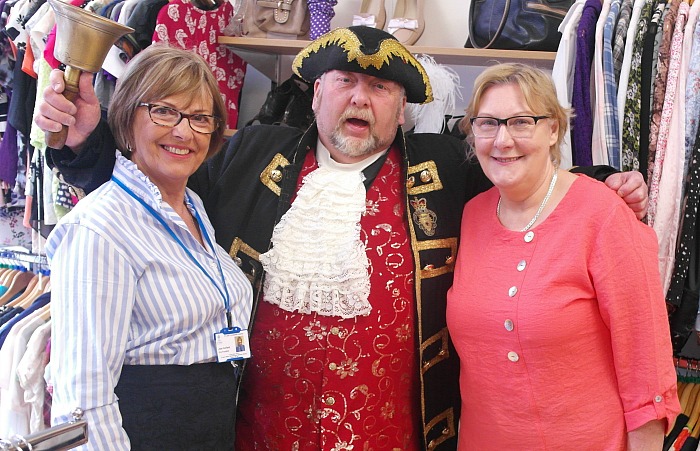 Nantwich Town Crier with staff at St Luke's Hospice charity shop