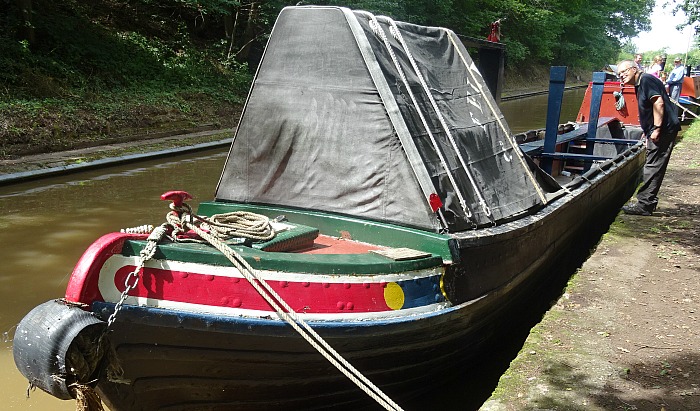 Visitor Mark Ray inspects a historic boat