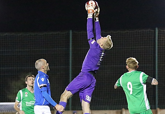 Warrington Town keeper Charlie Albinson catches the ball (1)