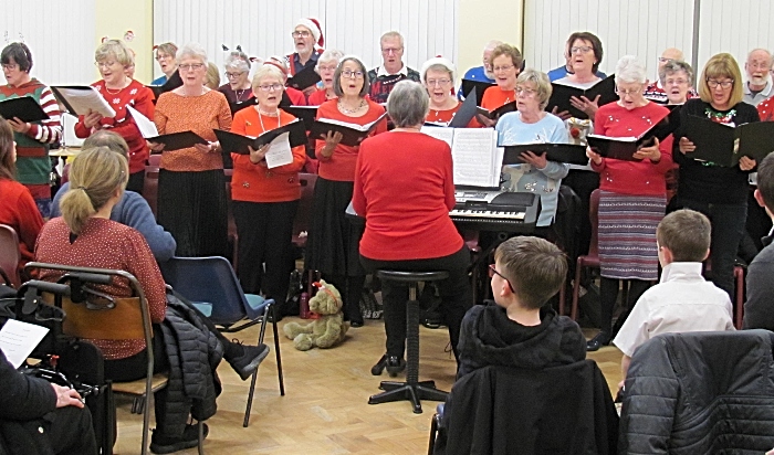 Wells Green Choir led by Myra Wood perform at the concert - community council