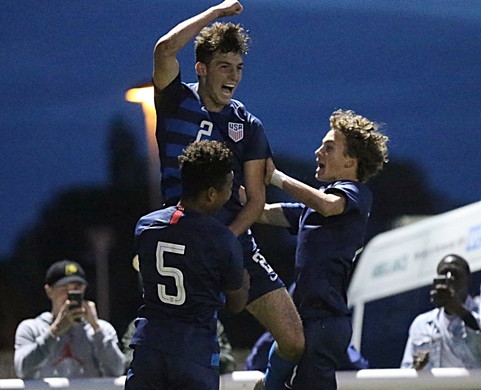 USA Winning goal - Joe Scally scores from the penalty mark and celebrates with teammates (1)