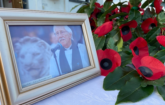 Wistaston - photo of Revd Ken Sambrook alongside a poppy arrangement (1)