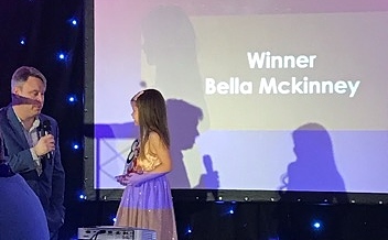 bella mckinney collecting her award