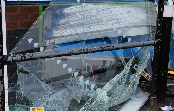 cashpoint machine embedded in co-operative store window