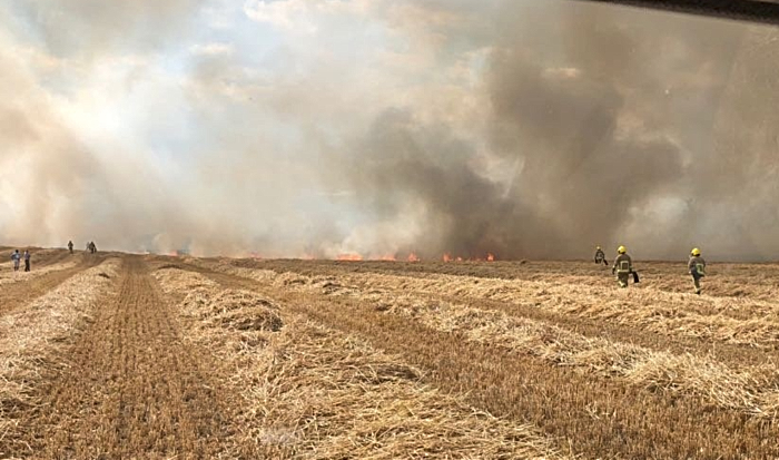 fire crews tackle farmland blaze at Burleydam