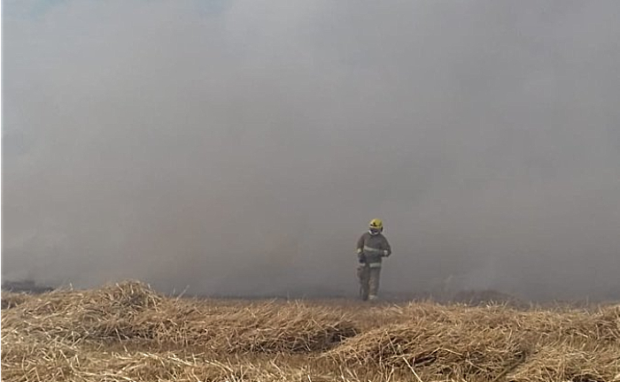 firefighter at farmland blaze at burleydam